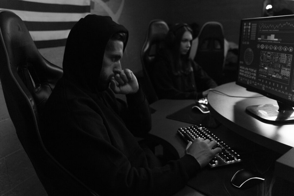 pexels photo 5380598 5380598 Two focused individuals analyze cybersecurity data on monitors, emphasizing digital protection strategies.